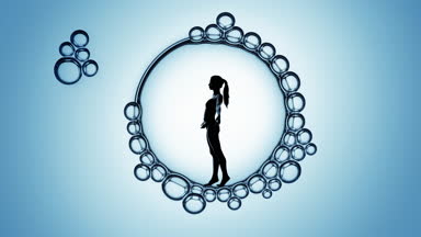 Woman's silhouette inside macro bubble on blue background