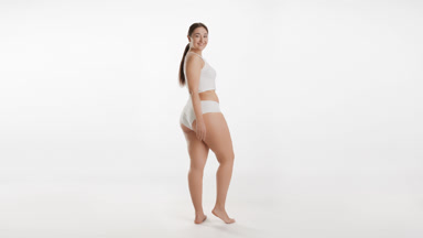 Young plus size female model turns head to camera and goes away
