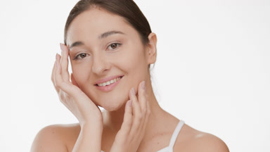 Plus size woman strokes face tilting head from side to side