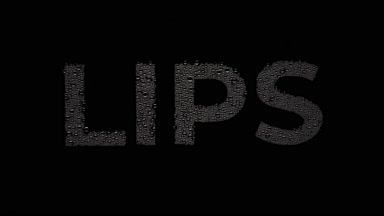 Lips text blown off the wet glass on black background