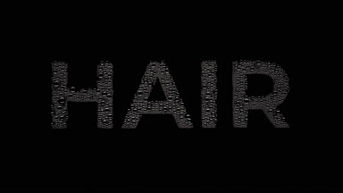 Hair word blown off the wet glass on black background