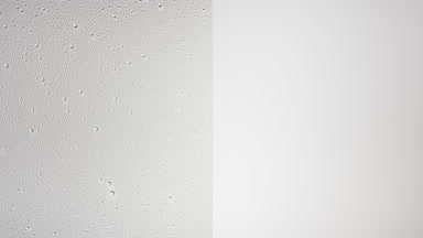 Water drops blown off the half misted glass surface on grey bg