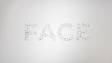 Face text blown off the wet glass on grey background