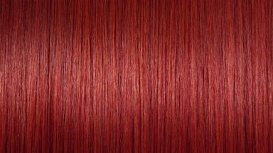 A wave passes through red dyed hair