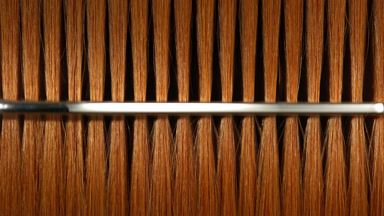Ginger hair being combed with silver comb