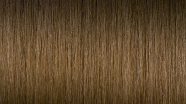 A stick running under honey brown hair surface making wave