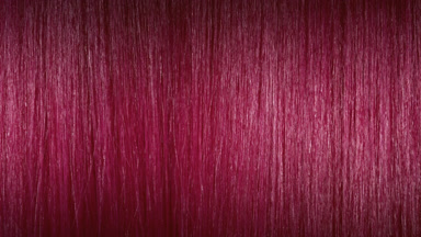 A wave passes through pink dyed hair