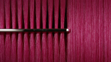 Silver comb combing pink hair