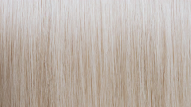 Light reflection passes through straight blonde hair