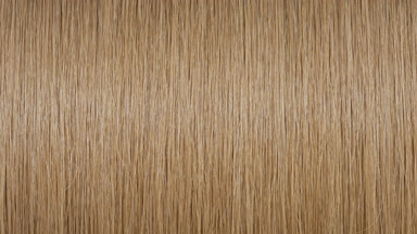 Reflection passes through honey brown hair