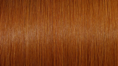 Light reflection passes through straight ginger hair