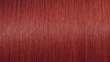 Reflection passes through red dyed hair