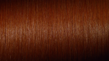 Light reflection passes through ginger hair