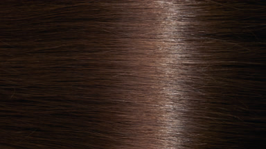 Reflection passes through brunette hair