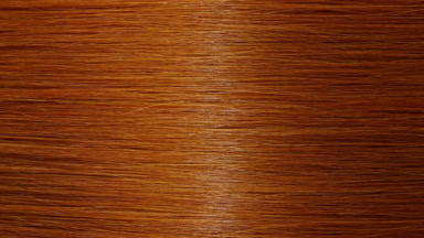 Reflection passes through ginger hair