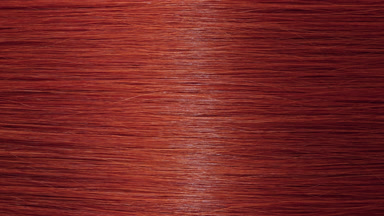 Light reflection passes through red dyed hair
