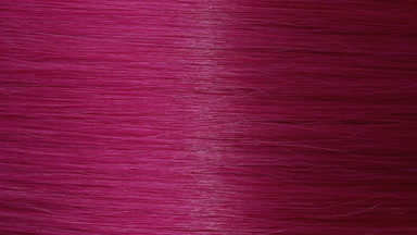 Reflection passes through pink dyed hair