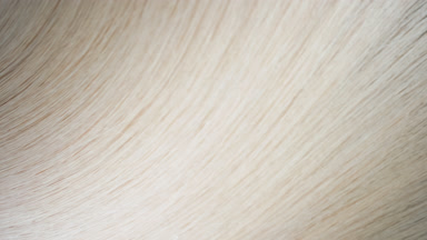 Flowing fair hair texture on flat surface