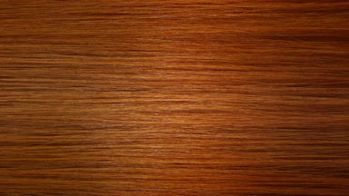 A stick running under red hair surface making wave