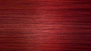 A wave passes through red dyed hair