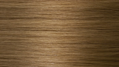 A wave passes through honey brown hair