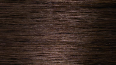 A stick running under brown hair surface making wave