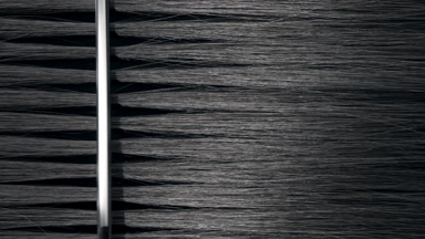 Silver comb combing black hair