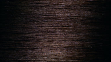 A wave passes through brown hair