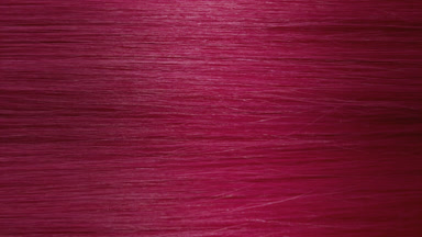 A wave passes through pink dyed hair