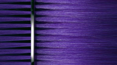 Silver comb combing violet hair