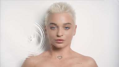 Pretty young slim Caucasian woman turns her head to the camera