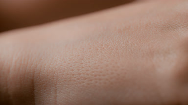 Macro shot of white good-looking healthy skin of female model