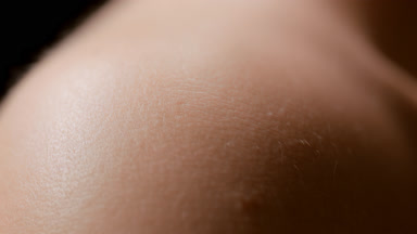 Macro shot of white pure smooth healthy skin of female model
