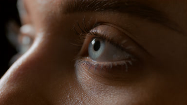 Macro shot of blue eyes of Caucasian female model blinking