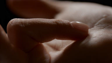 Macro shot of female model straightens her good-looking finger