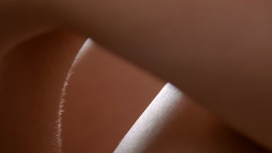 Macro shot of moving soft elastic healthy skin of female model