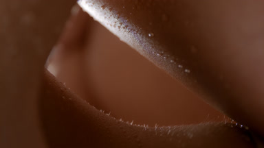 Macro of moving wet elastic clean healthy skin of female model