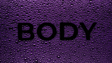 Purple body word blown off the wet glass on black background
