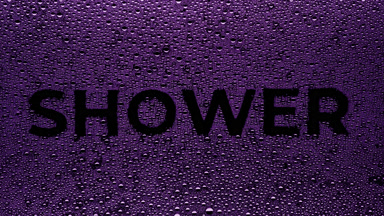 Purple shower writing blown off the wet glass on black bg
