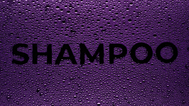 Purple shampoo text blown off the wet glass on black background