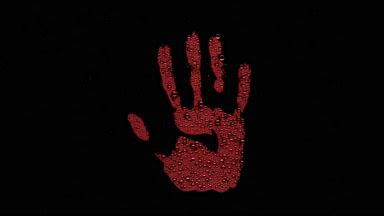 Red inverted handprint blown off the wet glass on black bg