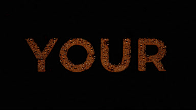 Orange your writing blown off the wet glass on black background