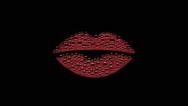 Red lip shape print blown off the wet glass on black background