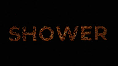 Orange shower word blown off the wet glass on black background