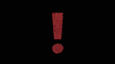 Red exclamation sign blown off the wet glass on black background