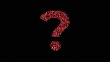 Red question mark blown off the wet glass on black background