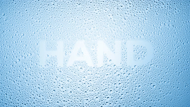 Blue hand inscription blown off the wet glass on blue background