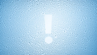 Blue exclamation sign blown off the wet glass on blue background