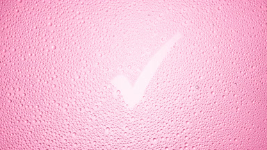 Checkmark blown off the wet glass on pink background