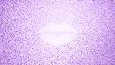 Lip shape print blown off the wet glass on violet background